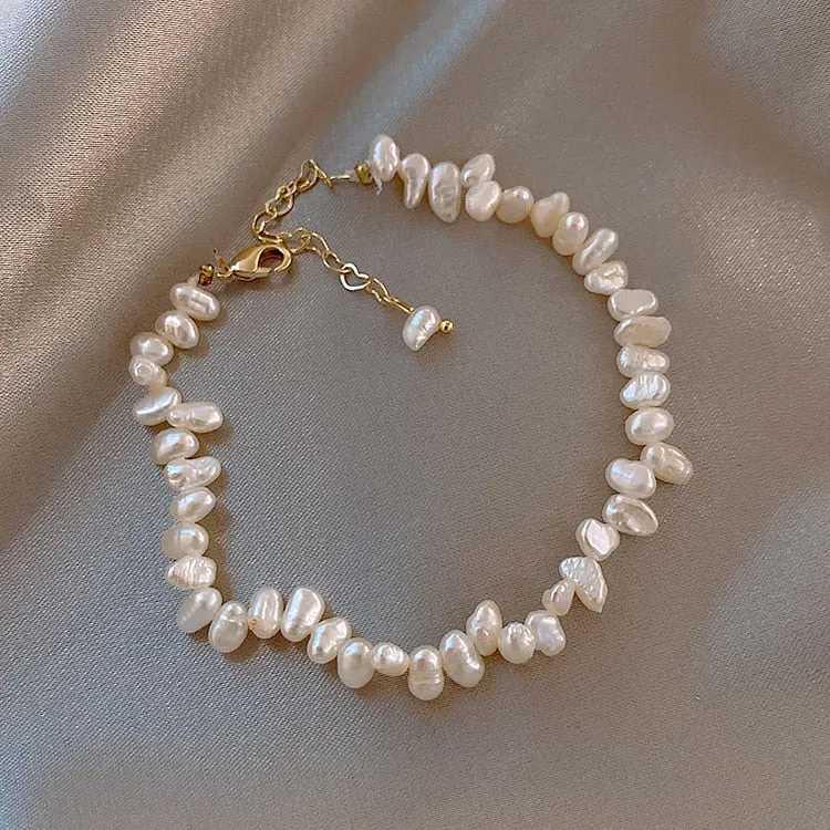 Elegant Freshwater Pearl Charm Bracelet with Copper Details