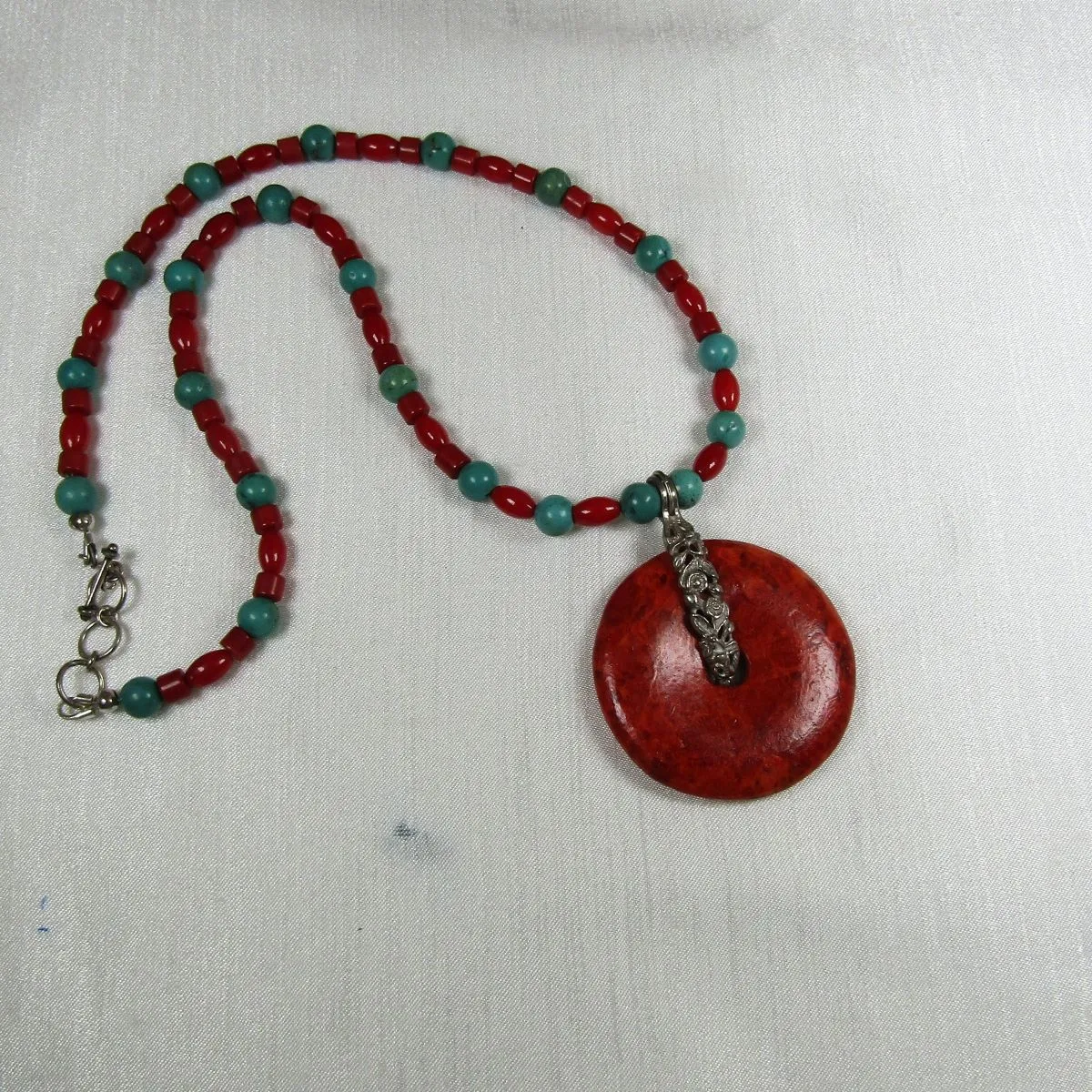 Handcrafted Turquoise Necklace with Red Pendant