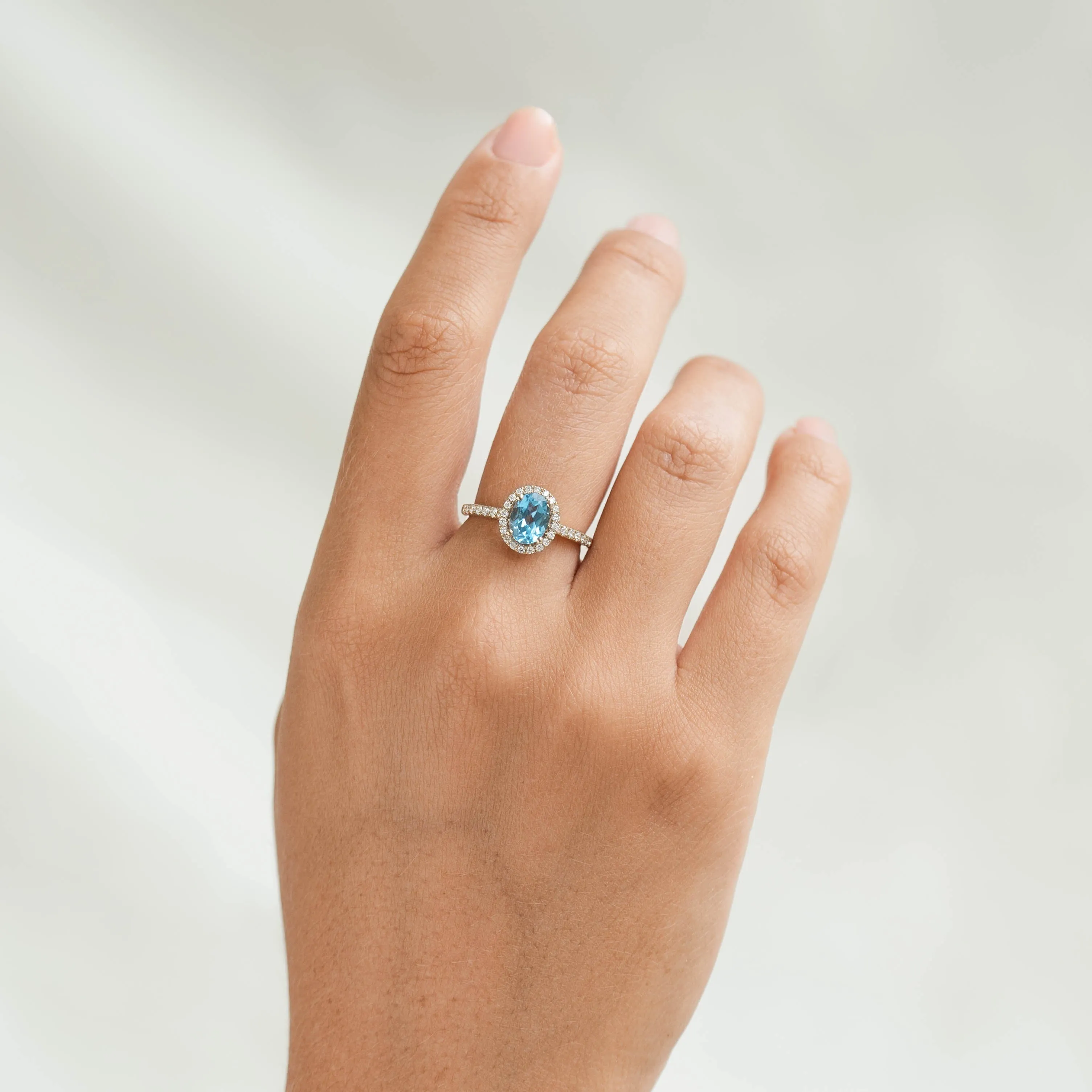 Oval Swiss Blue Topaz Halo Ring 14k Gold - Suna