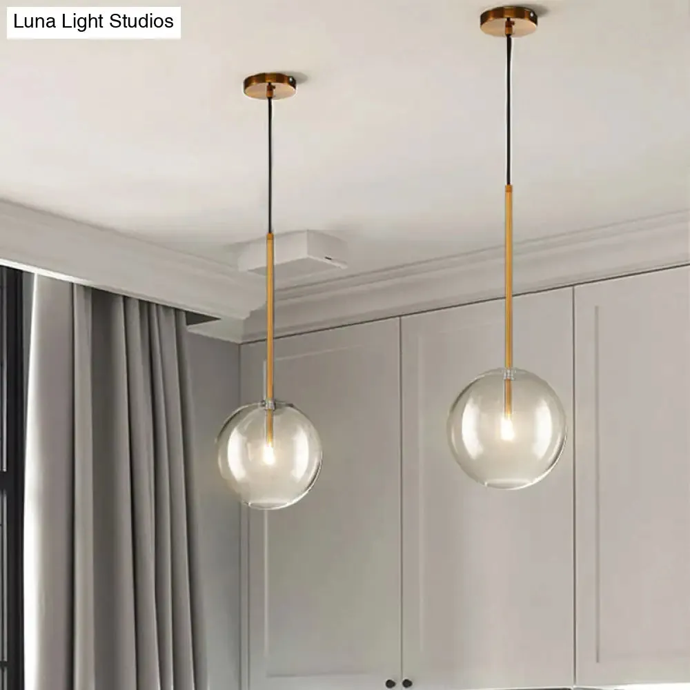 Sleek Gold Pendant Over Table: Clear Glass Globe Suspension Lighting (6"/8"/10" Wide)