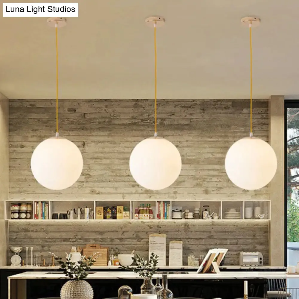 Sleek White Glass Pendant Light for Minimalist Table Settings