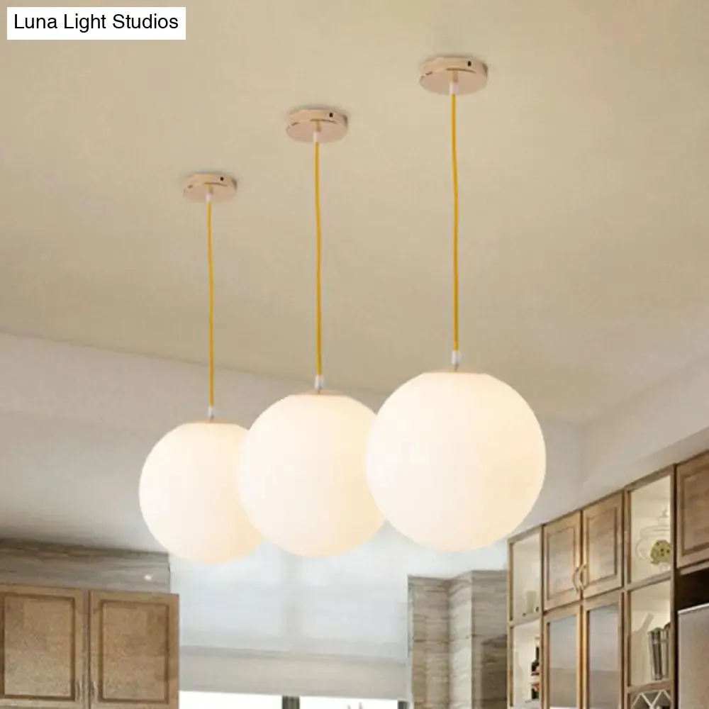 Sleek White Glass Pendant Light for Minimalist Table Settings