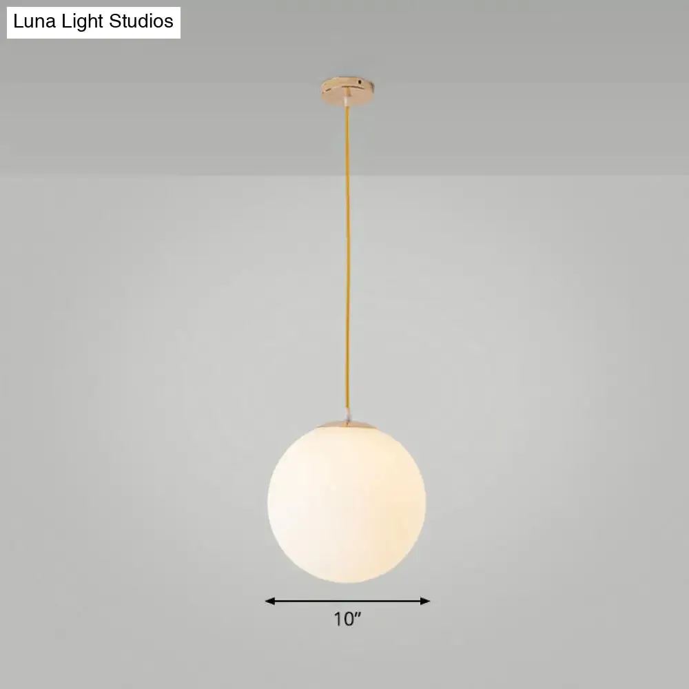 Sleek White Glass Pendant Light for Minimalist Table Settings