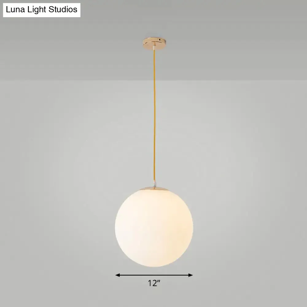 Sleek White Glass Pendant Light for Minimalist Table Settings