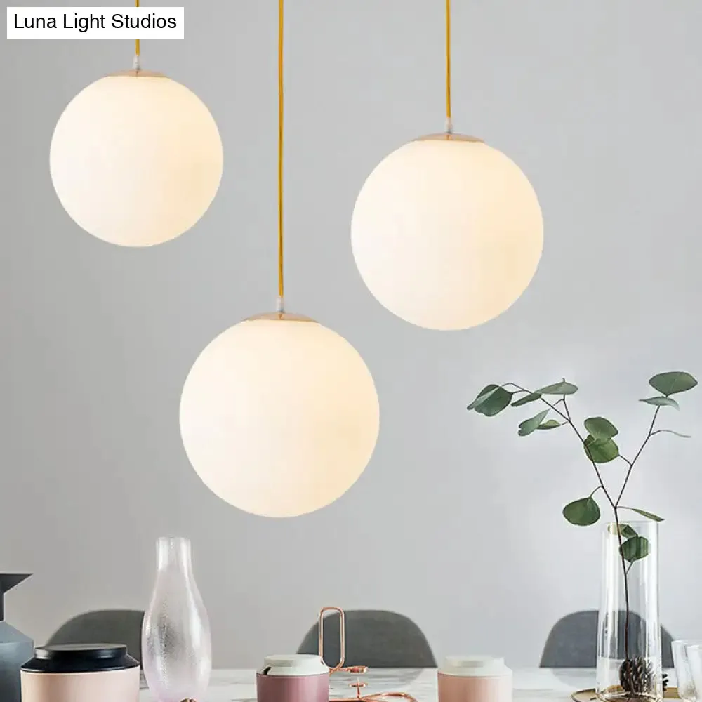 Sleek White Glass Pendant Light for Minimalist Table Settings