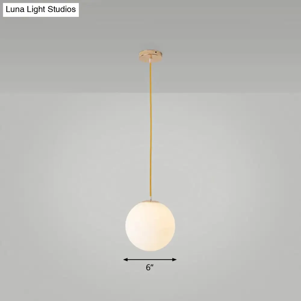 Sleek White Glass Pendant Light for Minimalist Table Settings